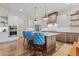 Kitchen featuring an island, stainless steel appliances, and ample cabinet space at 731 Weston Rd, Larkspur, CO 80118