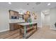 Basement kitchenette with island, stainless steel appliances, and wood cabinetry at 731 Weston Rd, Larkspur, CO 80118