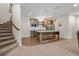 Basement kitchenette with island, stainless steel appliances, and wood cabinetry at 731 Weston Rd, Larkspur, CO 80118