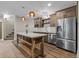 Kitchenette with island and stainless steel appliances at 731 Weston Rd, Larkspur, CO 80118