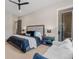 Serene main bedroom showcases a comfortable seating area, and a neutral color palette at 731 Weston Rd, Larkspur, CO 80118