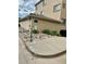 Lovely exterior of a tan home with rocks, landscaping, and tile roof at 13349 W Alameda W Pkwy # 102, Lakewood, CO 80228