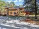 Relaxing backyard setting with snow on the ground and outdoor furniture next to a well maintained wood house at 18680 Arrowwood Dr, Monument, CO 80132