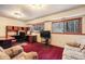 Basement with a large desk, sofa, and a window offering great views of the outdoors at 18680 Arrowwood Dr, Monument, CO 80132