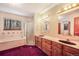 Bright bathroom with double vanity, soaking tub, shower and large windows showing snowy landscape at 18680 Arrowwood Dr, Monument, CO 80132