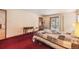 Comfortable bedroom featuring a plush bed, an exercise machine, and a sliding door to the outside at 18680 Arrowwood Dr, Monument, CO 80132