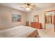 Cozy bedroom featuring a ceiling fan, wooden furniture, window view and comfortable decor at 18680 Arrowwood Dr, Monument, CO 80132