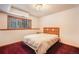 Bedroom with a large window and neutral walls creating a serene environment at 18680 Arrowwood Dr, Monument, CO 80132