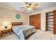 Neutral bedroom featuring ample closet space, natural light and wooden headboard at 18680 Arrowwood Dr, Monument, CO 80132