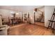 Bright, open dining room with hardwood floors, chandelier and stairs leading to the second story at 18680 Arrowwood Dr, Monument, CO 80132