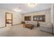Bright living room featuring neutral tones, comfortable seating and an open floorplan at 18680 Arrowwood Dr, Monument, CO 80132