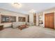 Bright living room with neutral tones, built-in shelving, and comfortable seating for relaxing at 18680 Arrowwood Dr, Monument, CO 80132