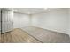 Basement with a combination of laminate flooring and carpet at 1050 S Monaco Pkwy # 125, Denver, CO 80224