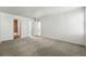 Spacious bedroom with neutral carpeting and white walls, ready for personalization at 1050 S Monaco Pkwy # 125, Denver, CO 80224