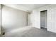 This bedroom offers soft carpet, a large closet with sliding doors, and neutral paint to make it your own at 1050 S Monaco Pkwy # 125, Denver, CO 80224