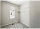 Walk-in closet includes a window with natural light and a hanging rack for organizing clothes and other items at 1050 S Monaco Pkwy # 125, Denver, CO 80224