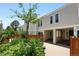Inviting condo with lush garden, private entrance, and covered parking space at 1050 S Monaco Pkwy # 125, Denver, CO 80224