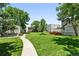 Beautiful condo community featuring mature trees and a meticulously maintained lawn at 1050 S Monaco Pkwy # 125, Denver, CO 80224