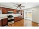 Kitchen featuring stainless steel appliances and a sliding glass door at 1050 S Monaco Pkwy # 125, Denver, CO 80224
