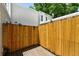 Private patio with wooden fence and outdoor space at 1050 S Monaco Pkwy # 125, Denver, CO 80224