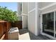 Outdoor patio space with fenced perimeter and sliding door access to the home at 1050 S Monaco Pkwy # 125, Denver, CO 80224