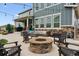 Backyard patio featuring a stone fire pit and outdoor seating, perfect for entertaining at 21854 Tyrolite Ave, Parker, CO 80138