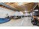 Unfinished basement with visible beams and a cozy seating area at 21854 Tyrolite Ave, Parker, CO 80138