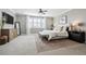 Inviting bedroom with soft carpet, ceiling fan, and a calming color scheme at 21854 Tyrolite Ave, Parker, CO 80138