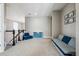 Upstairs bonus room offers a cozy seating area and playful decor at 21854 Tyrolite Ave, Parker, CO 80138