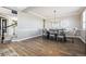 Elegant dining room featuring hardwood floors and a large dining table set for eight at 21854 Tyrolite Ave, Parker, CO 80138