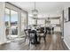 Dining area featuring a round table, chairs, and sliding glass doors to the outdoor space at 21854 Tyrolite Ave, Parker, CO 80138