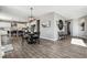 Open-concept dining area showcasing a round table, chairs, and seamless flow to the kitchen at 21854 Tyrolite Ave, Parker, CO 80138