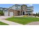 Charming two-story home with stone accents, well-kept lawn, and inviting curb appeal at 21854 Tyrolite Ave, Parker, CO 80138