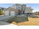 Beautiful two-story home featuring stone accents, a two-car garage, and well-maintained landscaping at 21854 Tyrolite Ave, Parker, CO 80138