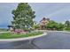 Exterior view of the community Grand Hall featuring traditional architecture and scenic landscaping at 21854 Tyrolite Ave, Parker, CO 80138