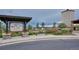 Community kiosk displaying local information, set beside a walking path with benches and landscaping at 21854 Tyrolite Ave, Parker, CO 80138