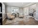 Stylish living room with comfortable chairs, elegant decor, and hardwood floors at 21854 Tyrolite Ave, Parker, CO 80138