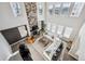 View of the living room showcasing the floor to ceiling stone fireplace and large windows at 21854 Tyrolite Ave, Parker, CO 80138