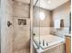 Bathroom with a tiled shower and a soaking tub with a view from the octagonal window at 1537 Rosedale St, Castle Rock, CO 80104