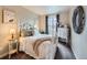 Cozy bedroom with neutral decor and a window with views of the neighborhood at 1537 Rosedale St, Castle Rock, CO 80104