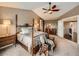 Bedroom featuring a four-poster bed, bedside tables, and a dresser at 1537 Rosedale St, Castle Rock, CO 80104