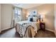 Bedroom with a comfortable bed, a window, and lamps on the bedside tables at 1537 Rosedale St, Castle Rock, CO 80104