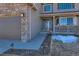 Charming home entrance with stone accents, walkway, covered porch, and well-maintained landscaping at 1537 Rosedale St, Castle Rock, CO 80104