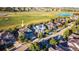 Beautiful aerial view of a suburban neighborhood with mature trees and golf course in the background at 2861 Eagle Cir, Erie, CO 80516