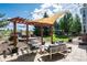 Outdoor space with a pergola, shade sail, and comfortable seating arrangement creates an inviting atmosphere at 2861 Eagle Cir, Erie, CO 80516