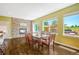 Dining room features a fireplace, a large window, and a view of the backyard at 2861 Eagle Cir, Erie, CO 80516