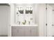 Elegant bathroom with double sinks, modern fixtures, and ample storage space at 46545 Sunflower Ln, Bennett, CO 80102