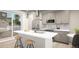 Modern kitchen with stainless steel appliances, a center island, and sliding glass doors leading to the outdoors at 46545 Sunflower Ln, Bennett, CO 80102