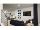 Cozy living room with comfortable seating, stylish decor, and a modern entertainment center at 46545 Sunflower Ln, Bennett, CO 80102