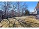 Large grass backyard with mature trees and privacy fence; great outdoor space and plenty of sunshine at 5706 S Garland Way, Littleton, CO 80123